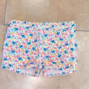 Tea Collection girl swim shorts. Orange and blue floral. Size 8.